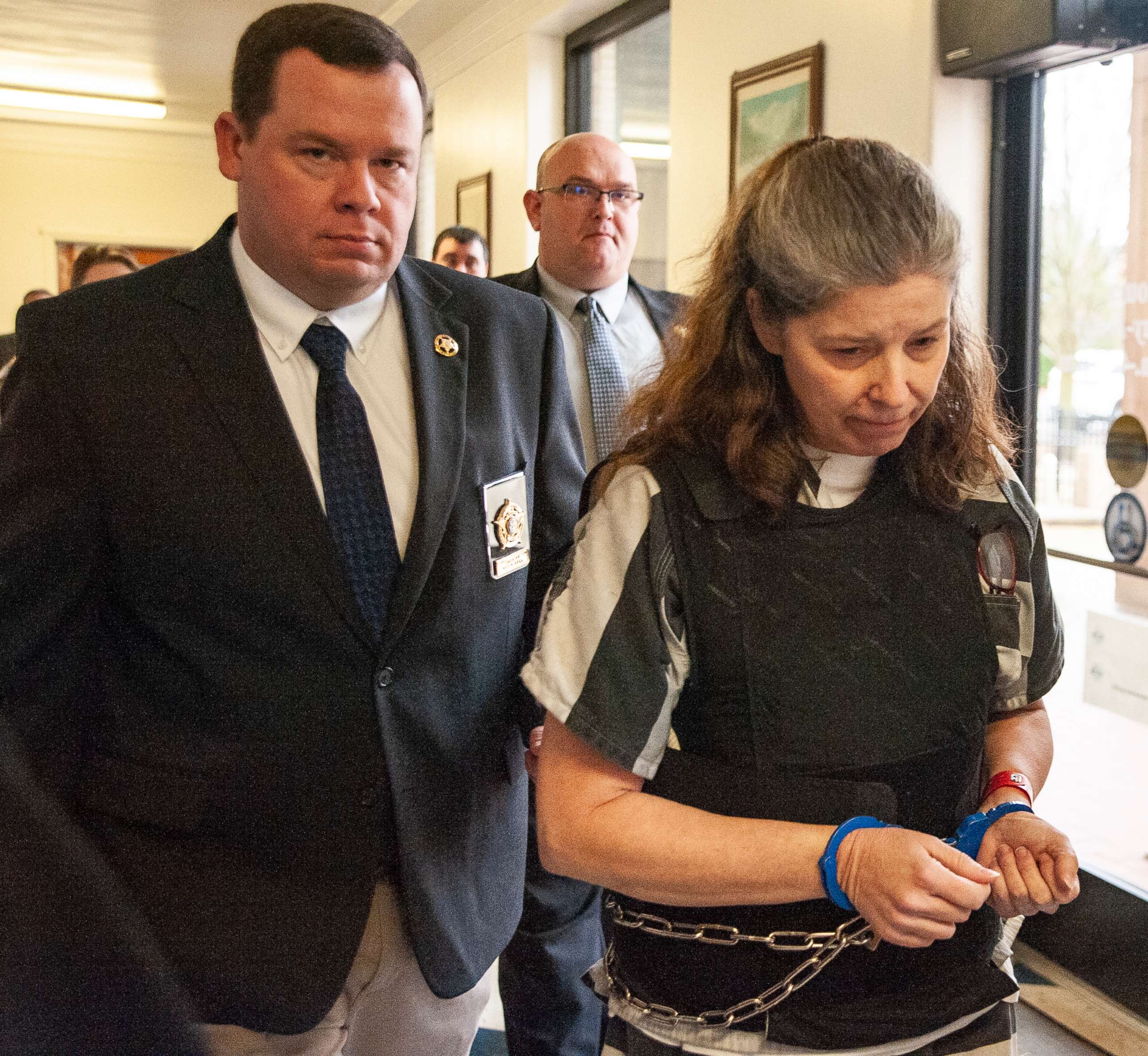 PHOTO: Rebecca O'Donnell is escorted down a hallway by Randolph County Sheriff Kevin Bell after a hearing on Wednesday, Jan. 29, 2020, at the Randolph County Courthouse in Pocahontas, Ark.