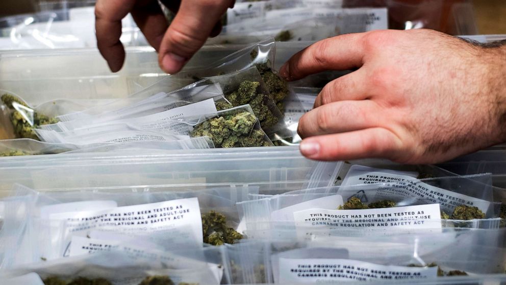 PHOTO: An employee stocks cannabis at a store shortly before its first day of recreational marijuana sales in San Francisco, Jan. 6, 2018.