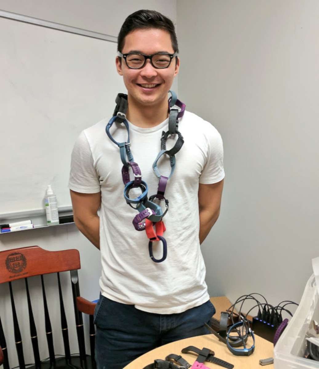 PHOTO: RecycleHealth intern wearing makeshift necklace out of donated fitness trackers in an undated photo.