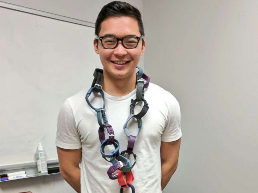 PHOTO: RecycleHealth intern wearing makeshift necklace out of donated fitness trackers in an undated photo.