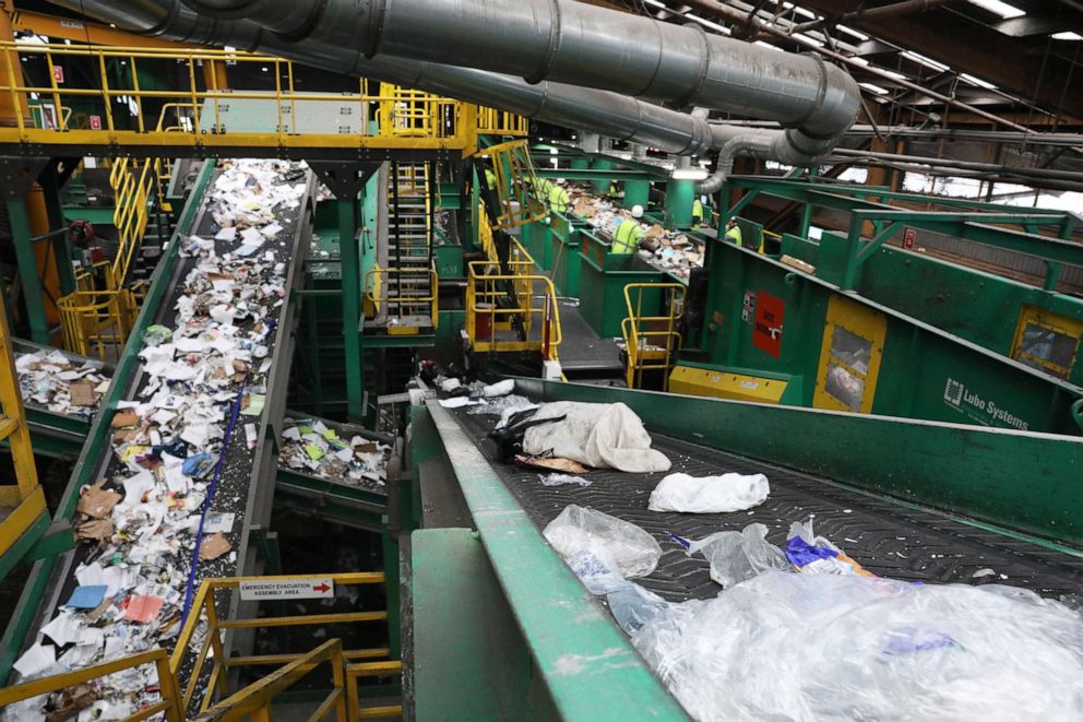 PHOTO: In this June 11, 2019, file photo, a conveyer belt moving flimsy and film plastic (bottom right), destined for landfill, carries pieces of plastic sorted from the initial sort deck through Recologys Recycle Central in San Francisco, Calif.