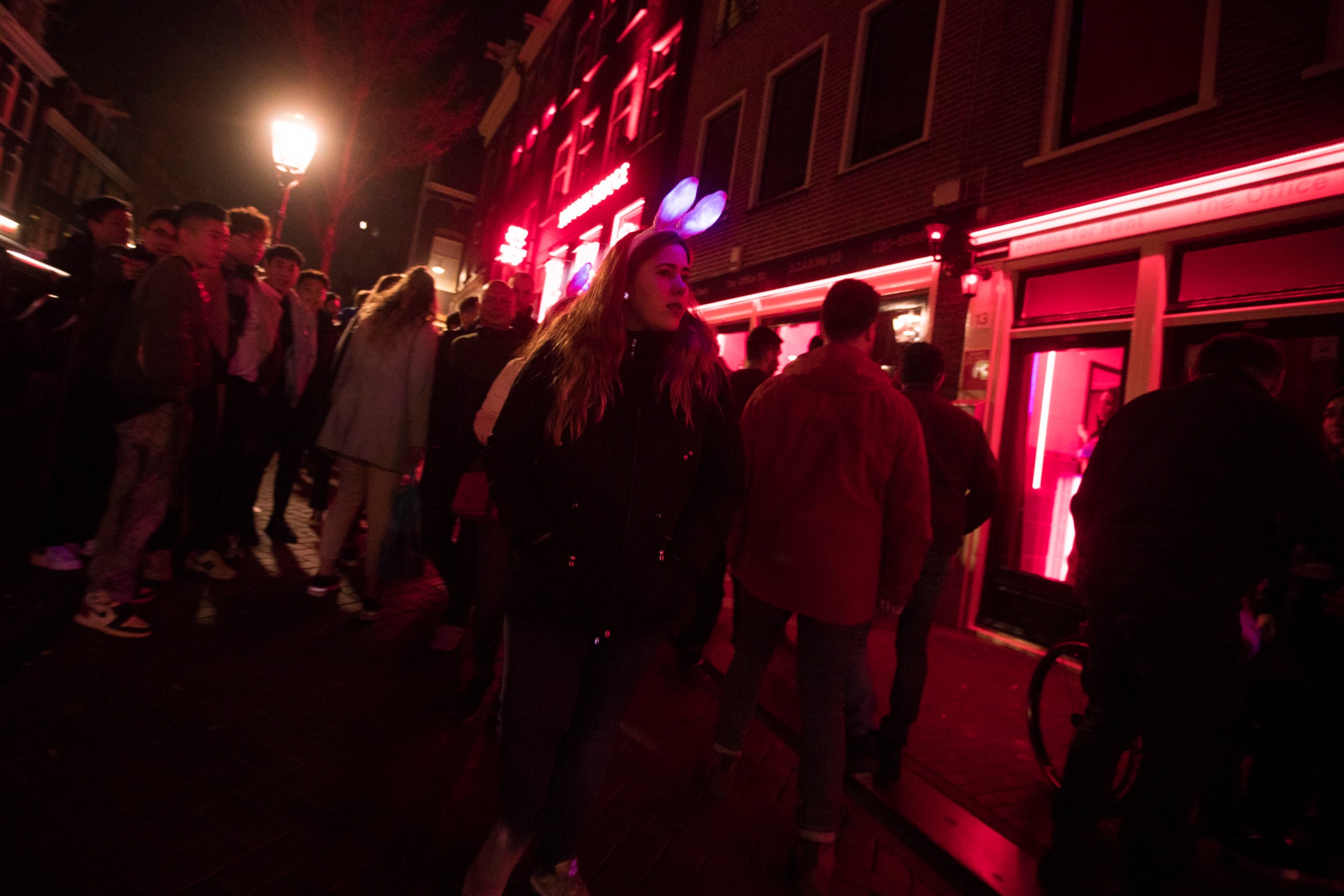 PHOTO: Tourists crowd the narrow canal-side streets in Amsterdam's red light district, Netherlands, Friday evening, March 29, 2019.