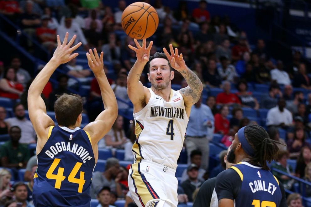 PHOTO: JJ Redick of the New Orleans Pelicans passes around Bojan Bogdanovic of the Utah Jazz during the second half of a game, Oct. 11, 2019 in New Orleans.
