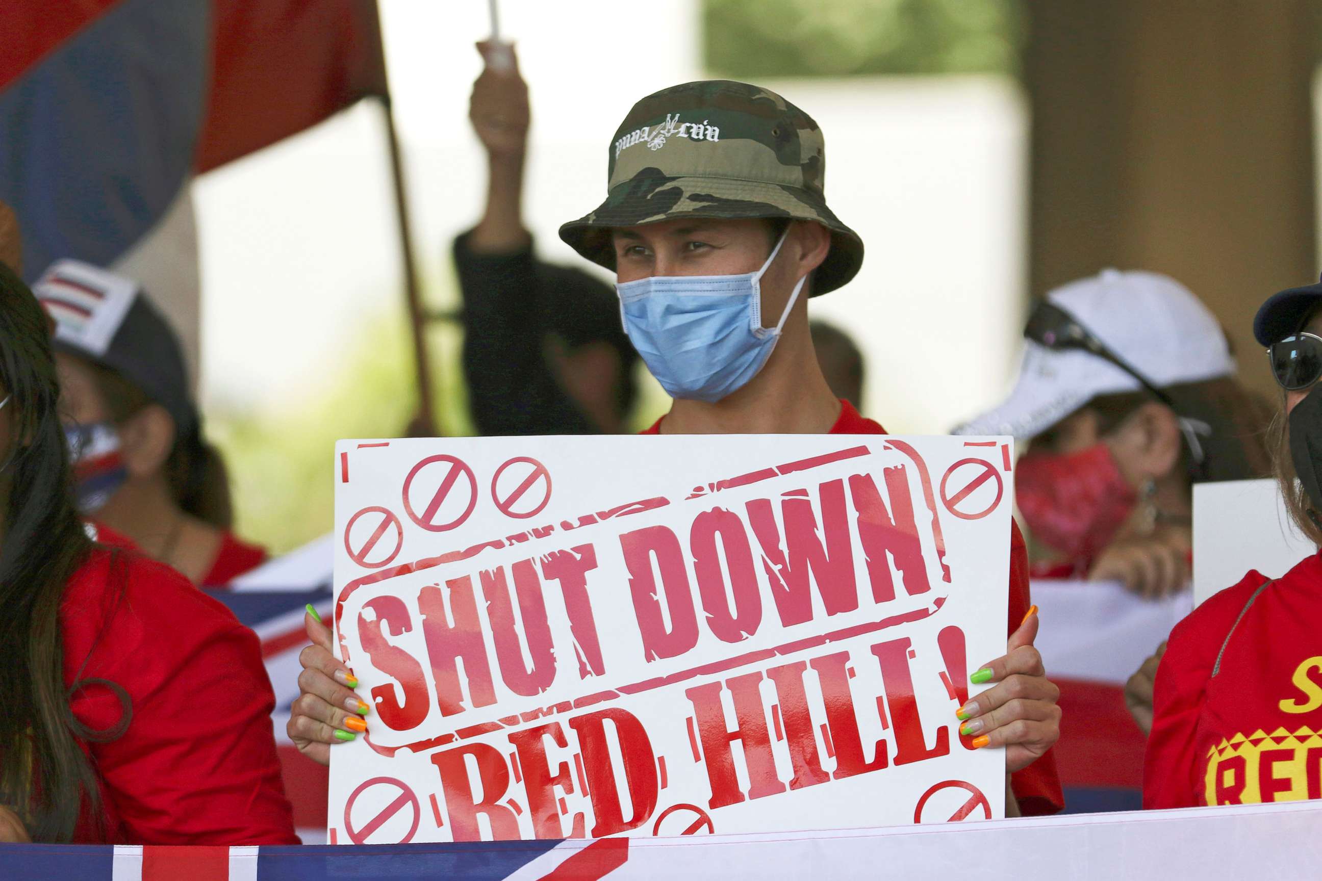 PHOTO: People hold signs in front of the Hawaii state Capitol during a rally calling for the closure of the Navy's Red Hill underground fuel storage facility near Pearl Harbor, Feb. 11, 2022 in Honolulu. Late last year jet fuel leaked into drinking water.