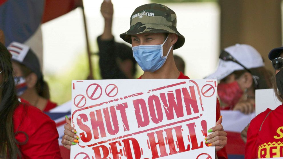 PHOTO: People hold signs in front of the Hawaii state Capitol during a rally calling for the closure of the Navy's Red Hill underground fuel storage facility near Pearl Harbor, Feb. 11, 2022 in Honolulu. Late last year jet fuel leaked into drinking water.