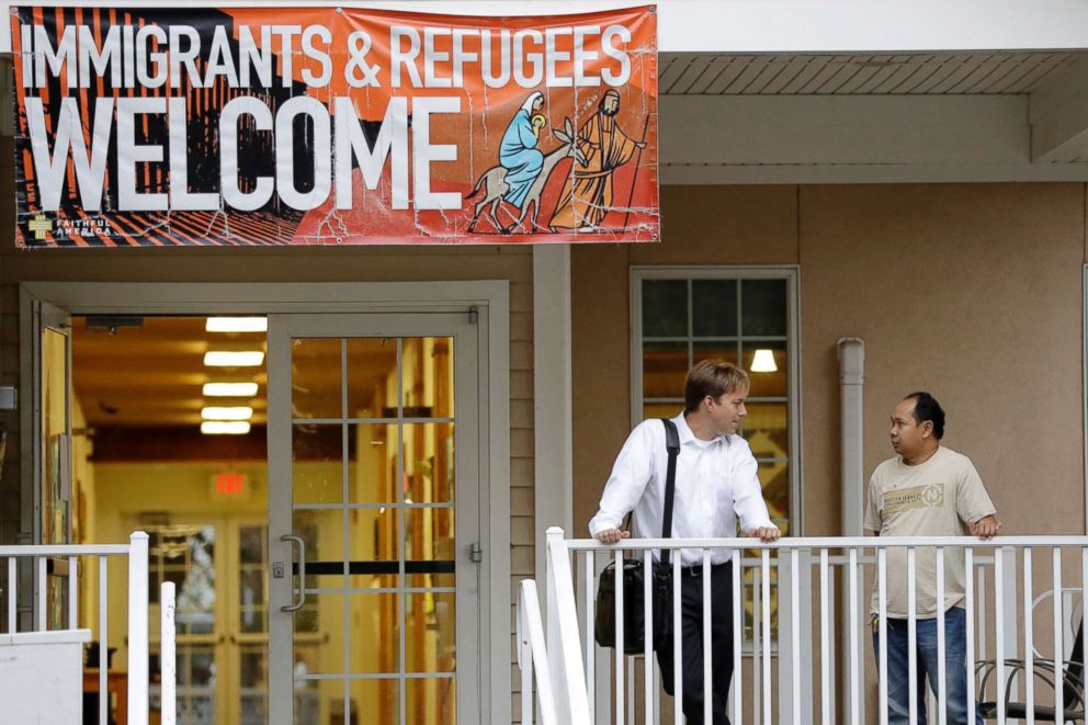 PHOTO: Seth Kaper-Dale, left, a pastor, talks to Arthur Jemmy, an Indonesian man who is taking sanctuary in Kaper-Dale's church to avoid deportation  in Highland Park, N.J. 