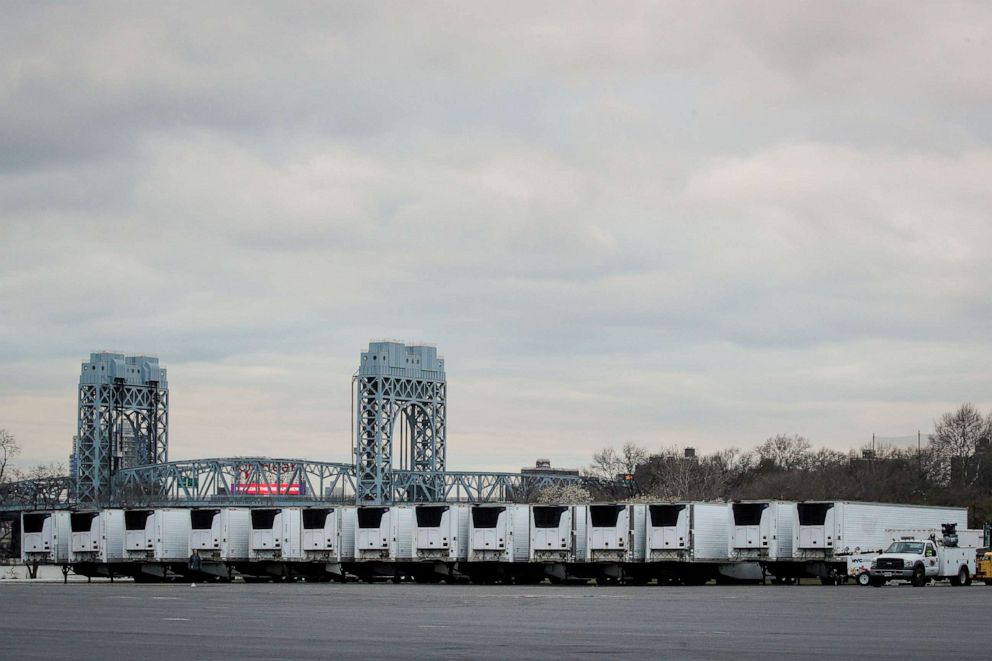 PHOTO: Refrigerated tractor-trailers that can be used by hospitals for makeshift morgues are seen during the coronavirus pandemic, in Icahn Stadium parking lot on Randall's Island in New York City, New York, March 31, 2020.