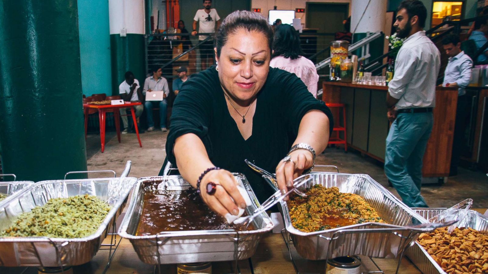 PHOTO: Nasrin found a job at Eat Offbeat, an NYC based refugee run catering company.