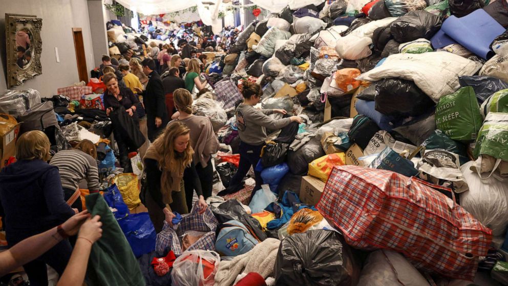 PHOTO: Volunteers sort through donations at the White Eagle Club, ahead of their convoy leaving to deliver aid to those fleeing the Russian invasion in Ukraine, in London, Feb. 28, 2022.