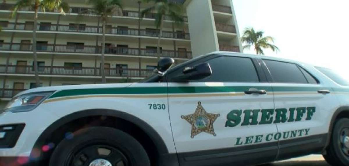 A Lee County Sheriff's Office vehicle sits outside the apartment complex in Fort Myers Beach, Fla., where Lois Hutchinson was found dead on April 9, 2018.