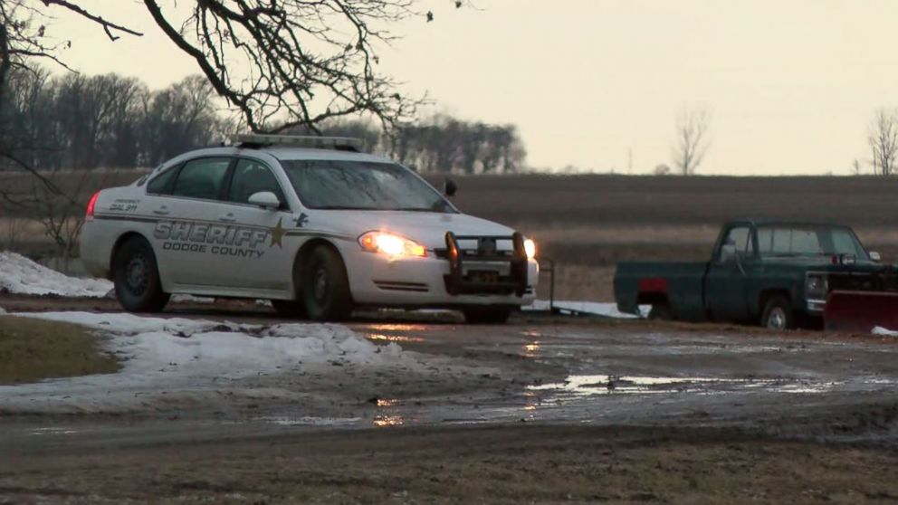 Dodge County sheriffs investigate the scene outside Lois Reiss' home in Blooming Prairie, Minnesota, on March 23, 2018. Reiss is suspected in the murder of her husband, David.