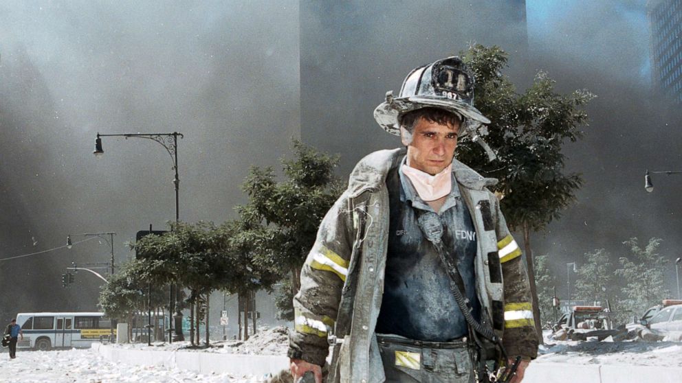 PHOTO: An unidentified New York City firefighter walks away from Ground Zero after the collapse of the Twin Towers, Sept. 11, 2001, in New York.