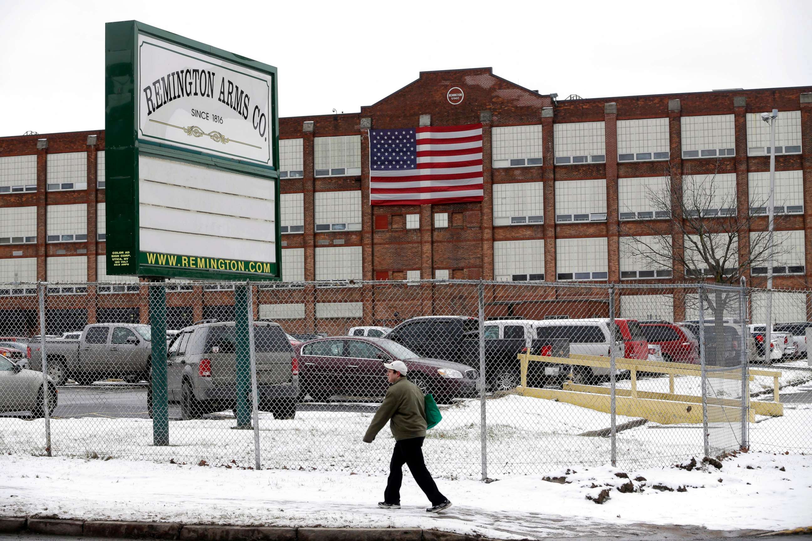 PHOTO: A man walks past the Remington Arms Company in Ilion, N.Y., Jan. 17, 2013.