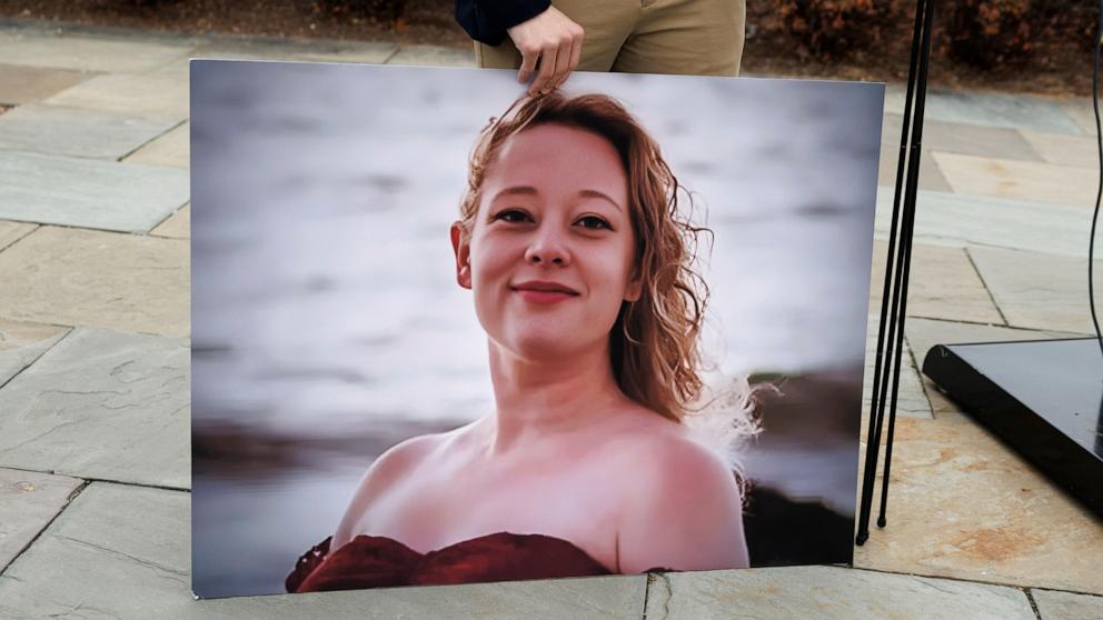 PHOTO: A staff member holds a photograph of Renee Nicole Good after a press conference calling for accountability on Immigration and Customs Enforcement agents' activity at the US Capitol in Washington, January 14, 2026.