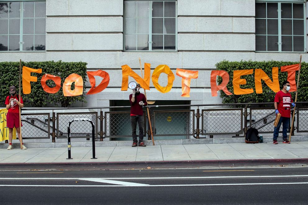 PHOTO: Protesters hold a banner reading 'Food Not Rent' during a rent strike demonstration in front of the Downtown City Hall amid the coronavirus pandemic in Los Angeles, April 30, 2020.
