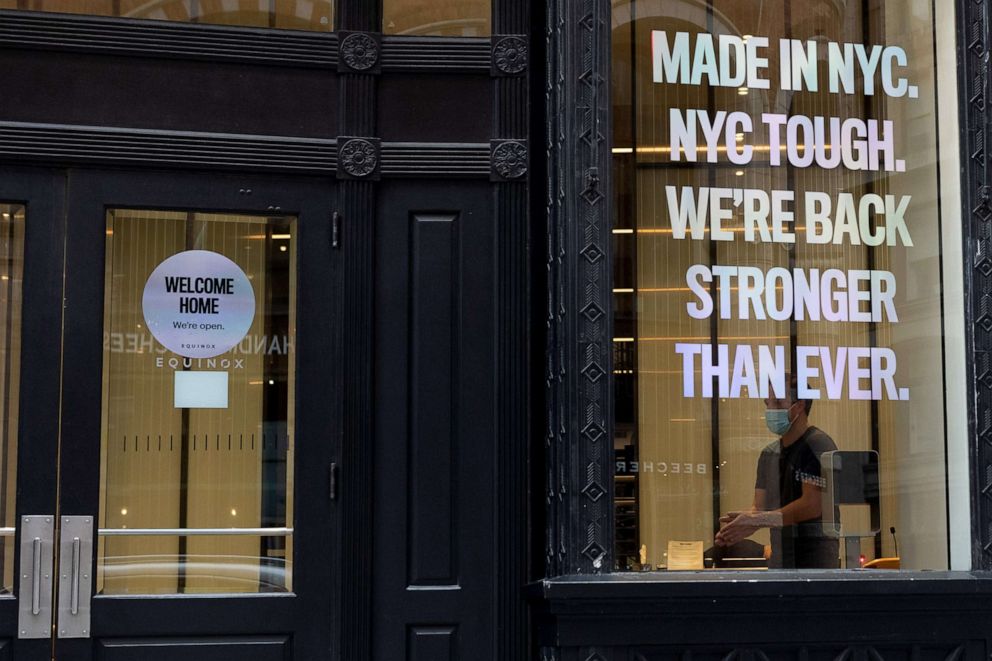 PHOTO: A restaurant worker is seen through a window displaying the sign "Made in NYC. NYC Tough. We're Back Stronger Than Ever" as the city continues re-opening following restrictions to slow the spread of coronavirus in New York, Sept. 2, 2020.  