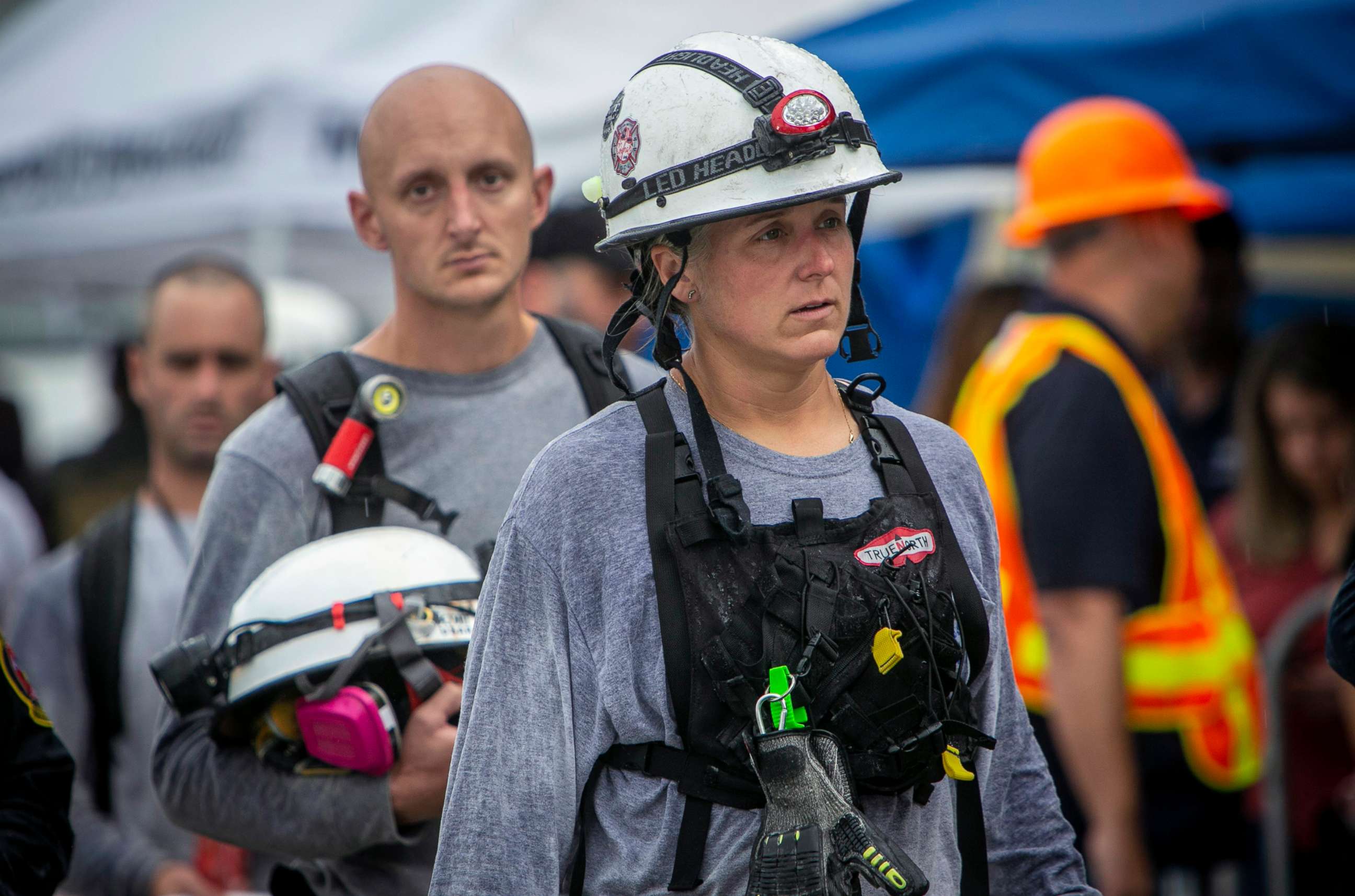 PHOTO: Members of a search and rescue team come off the site of the collapse after their shift in Surfside, Fla., June 30, 2021. 