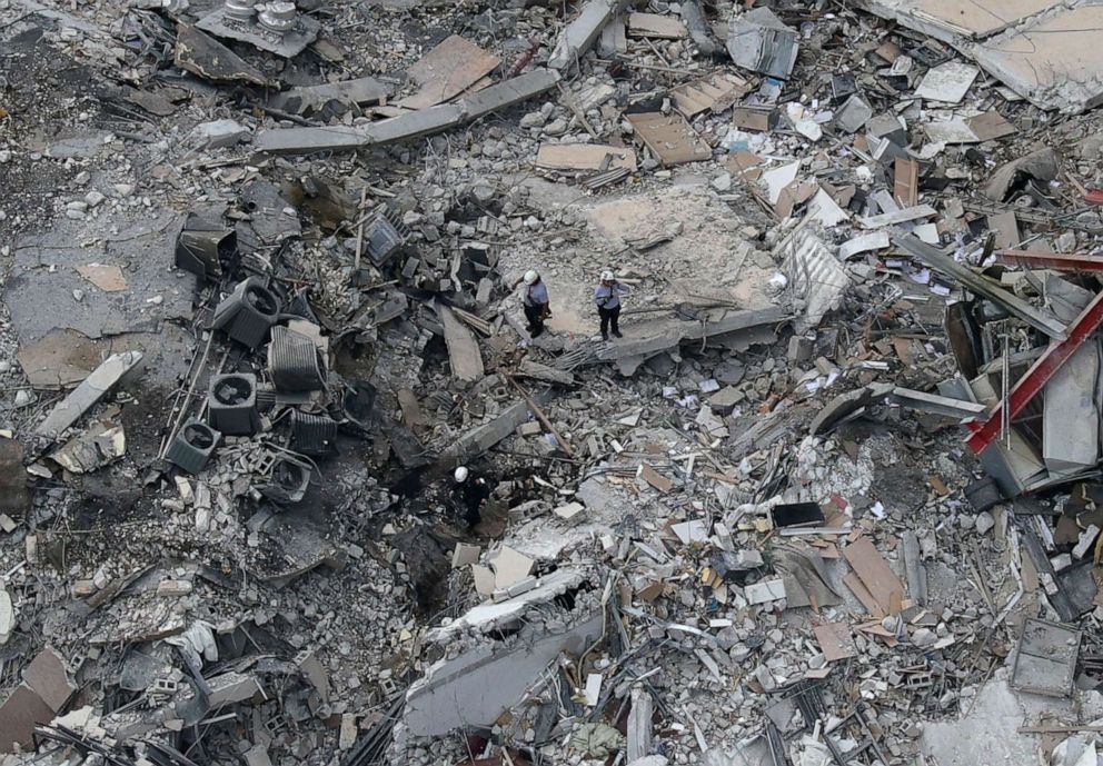 PHOTO: Search and rescue personnel work in the rubble of the 12-story condo tower that crumbled to the ground during a partially collapse of the building, June 24, 2021, in Surfside, Fla., near Miami Beach.