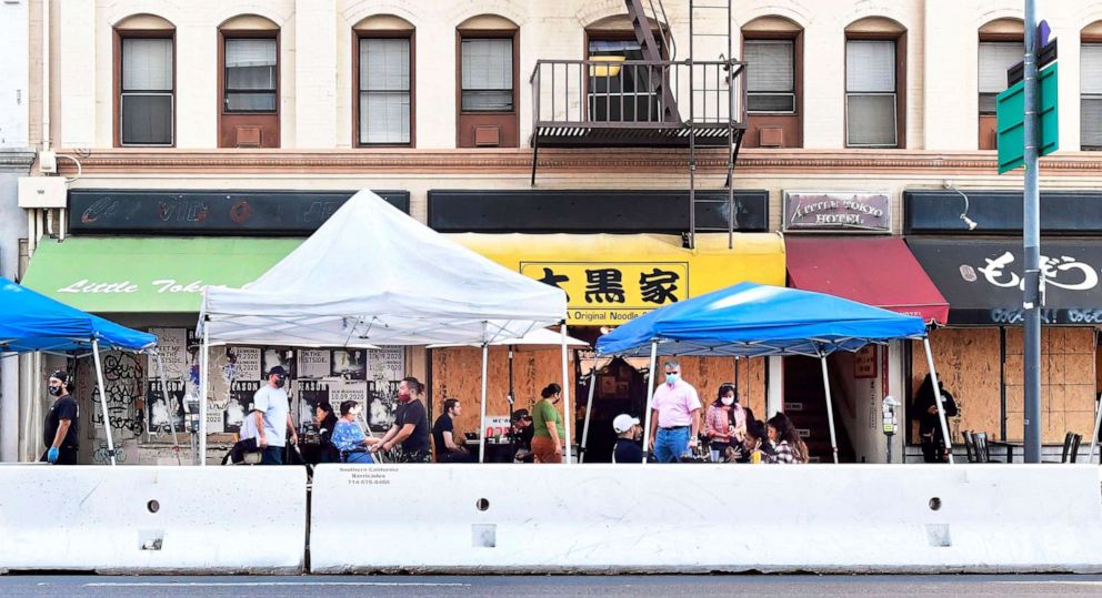 PHOTO: Barricades line a street to protect outdoor diners from traffic, Nov. 17, 2020, in Los Angeles.