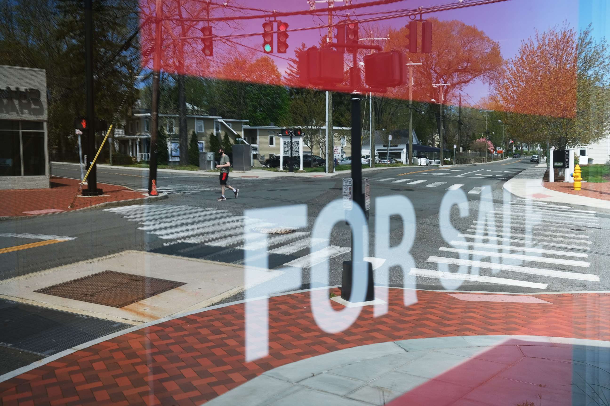 PHOTO: A main shopping street of closed stores in an affluent community remains mostly empty of pedestrians in Westport, Connecticut, on May 5, 2020.