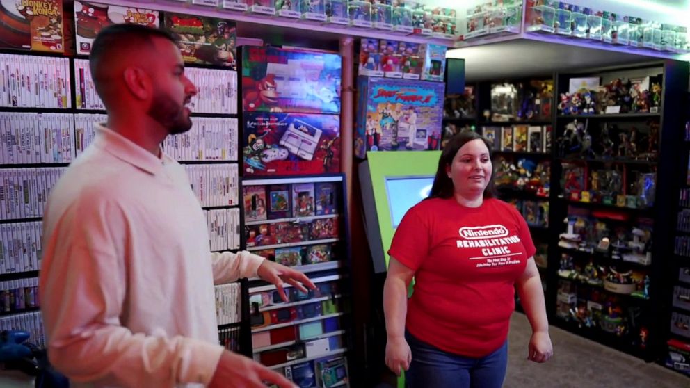 PHOTO: Retro game collector Brandi Ahmer shows off her basement game room to ABC News' Ashan Singh.