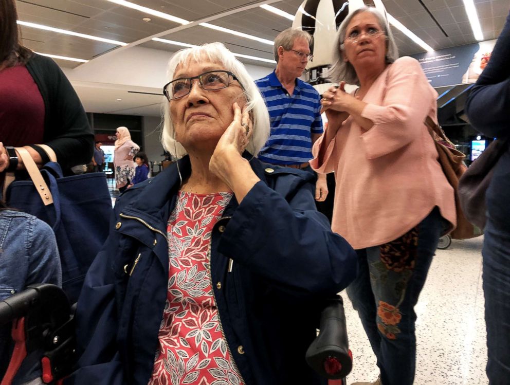 PHOTO: Una Pereira, front, waits with her daughter Theresa Wright and her husband, John Wright, Oct 18th, 2018.