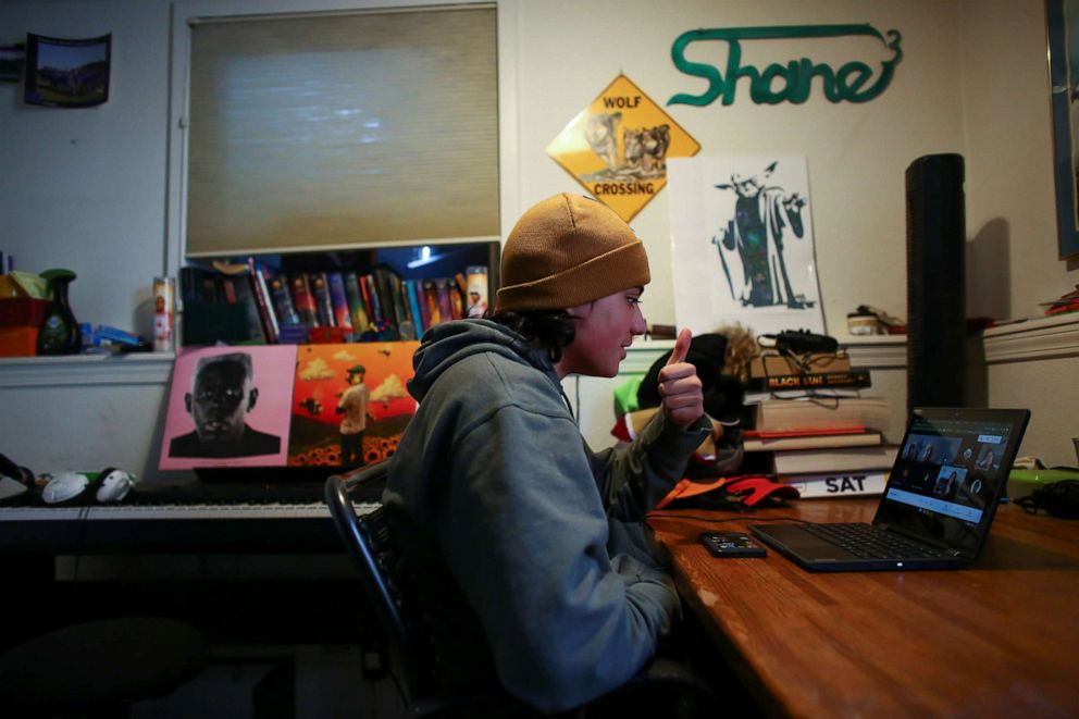 PHOTO: Shane Wolf, 18, attends an online class in which Native American students meet regularly with a Lakota elder, Sid Whiting, in Denver, March 19, 2021.