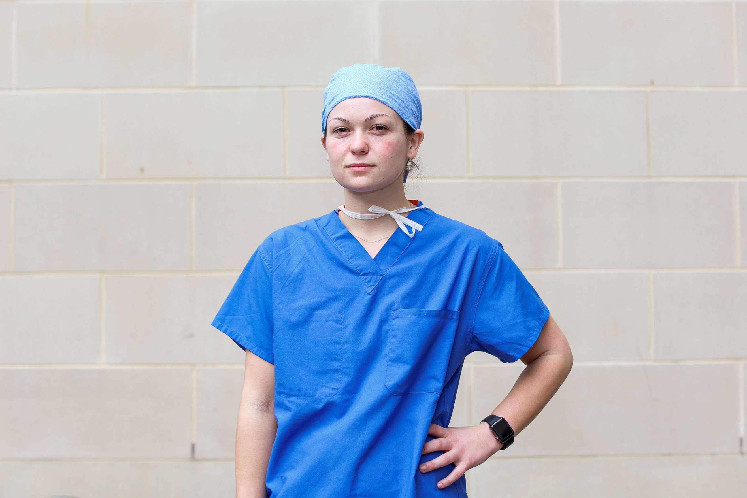 PHOTO:Julia Trainor, 23, a registered nurse who is caring for COVID-19 patients at a surgical intensive care unit (ICU), poses for a photograph after a 14-hour shift during the coronavirus disease outbreak, Md., April 8, 2020.