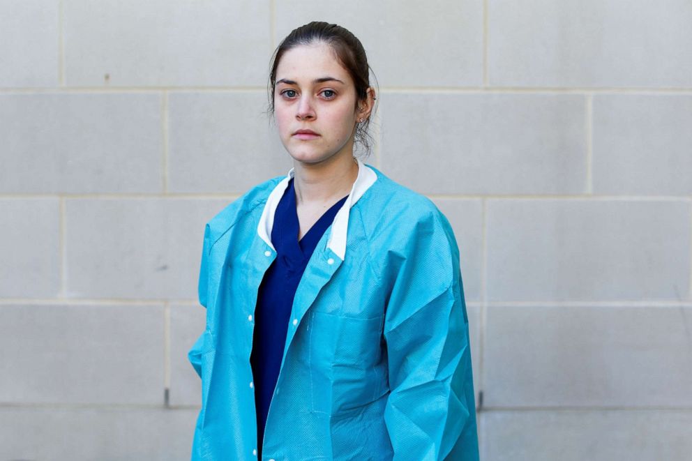 PHOTO: Tiffany Fare, 25, a registered nurse who works at a biocontainment unit with COVID-19 patients, poses for a photograph after a 13-hour shift, outside the hospital where she works, during the coronavirus disease outbreak, Md., April 6, 2020.