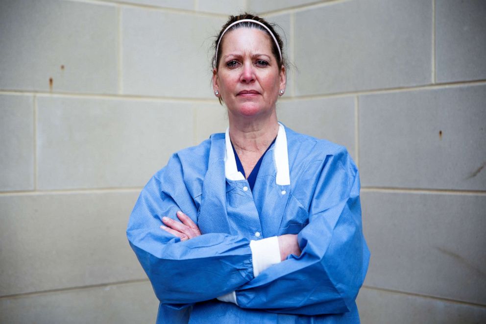 PHOTO: Tracey Wilson, 53, a nurse practitioner who is caring for COVID-19 patients in an intensive care unit (ICU), poses for a photograph after a 12-hour shift, outside the hospital during the coronavirus disease outbreak, Md., April 3, 2020.