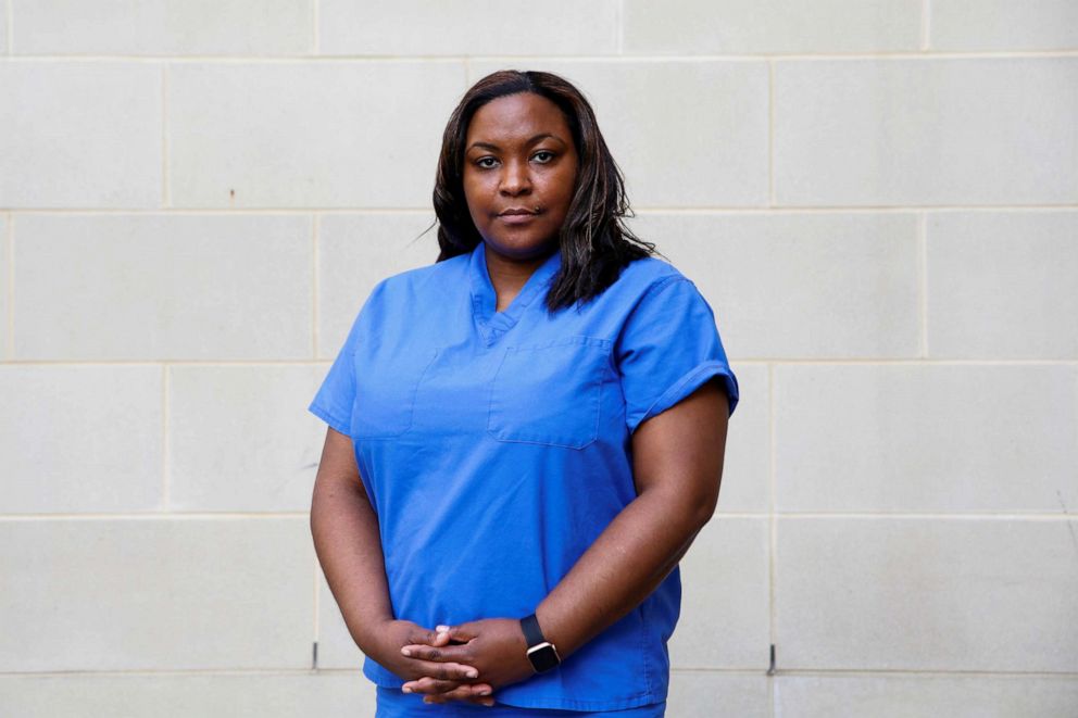 PHOTO:Martine Bell, 41, a nurse practitioner who is caring for COVID-19 patients in an emergency department, poses for a photograph after a six-hour shift outside the hospital where she works, during the coronavirus disease outbreak, Md., April 6, 2020.