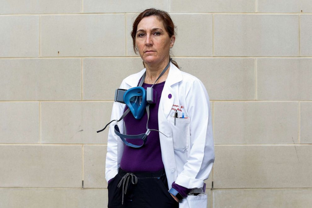 PHOTO: Dr. Laura Bontempo, 50, an emergency medicine doctor who is taking care of COVID-19 patients, wears her personal protective equipment she uses when she sees patients  after a nine-hour shift, outside the hospital in Md., April 5, 2020. 