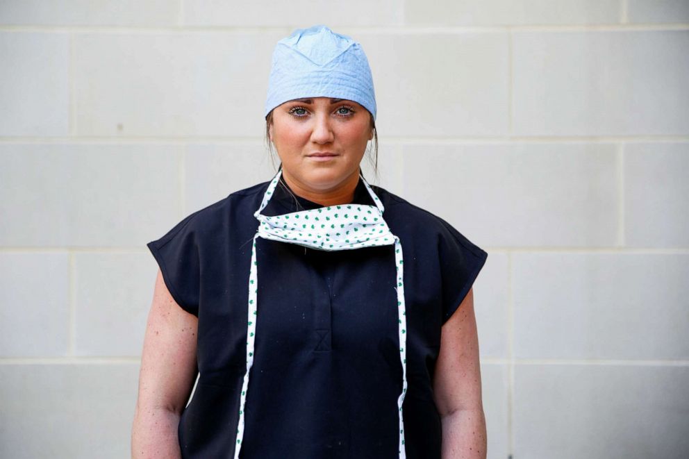 PHOTO:Meghan Sheehan, 27, a nurse practitioner who is caring for COVID-19 patients at an emergency department, poses for a photograph after a 12-hour shift, outside the hospital where she works, during the coronavirus disease outbreak, Md., April 6, 2020.