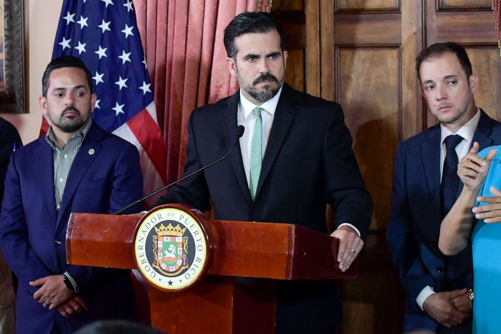 PHOTO: Puerto Rico Gov. Ricardo Rossello, accompanied by his chief of staff Ricardo Llerandi, right, attends a press conference in La Fortaleza's Tea Room, in San Juan, Puerto Rico.