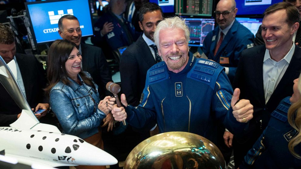 PHOTO: In this file photo taken on Oct. 28, 2019, Richard Branson, founder of Virgin Galactic poses next to George T. Whitesides, CEO of Virgin Galactic Holdings after ringing the bell at the New York Stock Exchange in New York City.