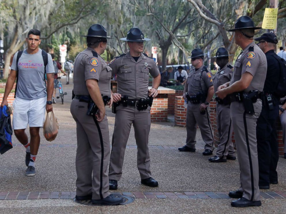 PHOTO: Florida Highway Patrol officers stand guard the day before a speech by Richard Spencer, an avowed white nationalist and spokesperson for the so-called alt-right movement, on the campus of the University of Florida, Oct. 18, 2017.
