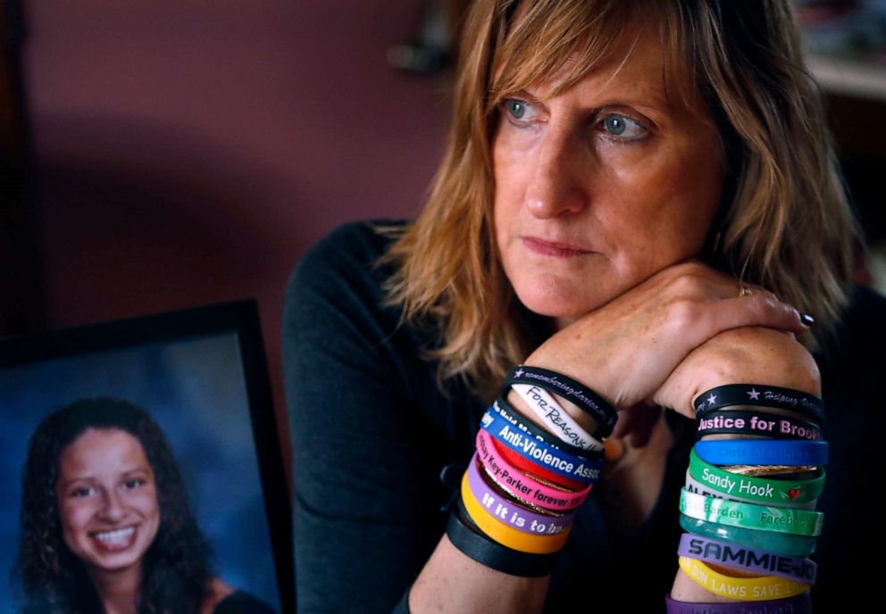 PHOTO: Judi Richardson, a citizen sponsor of a ballot initiative to require background checks for gun buyers, wears wrist bands bearing the names and places of victims of gun violence, at her home in South Portland, Maine, Oct. 26, 2017.