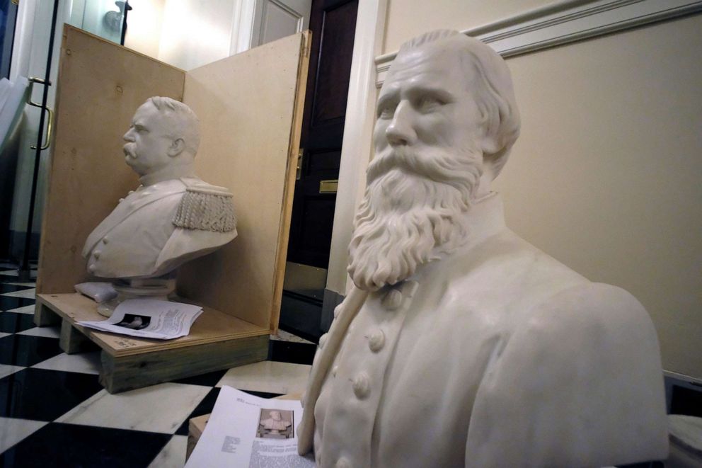 PHOTO: Busts of Fitzhugh Lee, left, and James E. B "Jeb" Stuart, right sit in a hallway waiting to be boxed after removal from the Old House Chamber inside the Virginia State Capitol in Richmond, Va., July 23, 2020.