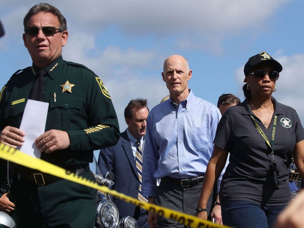 PHOTO: Florida Governor Rick Scott,(C) walks to the media to speak about the mass shooting at Marjory Stoneman Douglas High School where 17 people were killed yesterday, on Feb. 15, 2018, in Parkland, Fla.