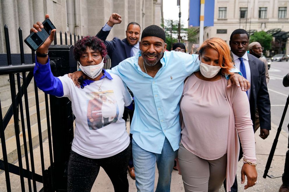 PHOTO: Eric Riddick, center, accompanied by his mother Christine Riddick, left, and wife Dana Baker-Riddick walks from a courthouse in Philadelphia on May 28, 2021, after spending nearly three decades in prison for a murder he says he did not commit.