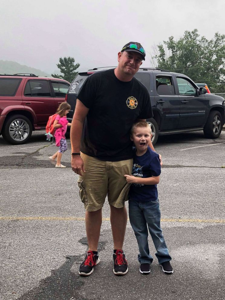 PHOTO: Cooper Brooks, 5, seen in August 2018 on his first day of kindergarten with assistant fire chief John Kemp, who brought him to school that day. 