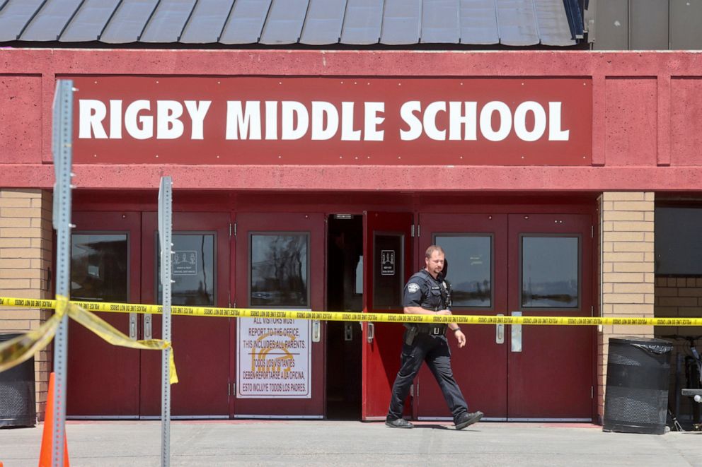 PHOTO: A police officer walks out of Rigby Middle School following a shooting there earlier Thursday, May 6, 2021, in Rigby, Idaho.