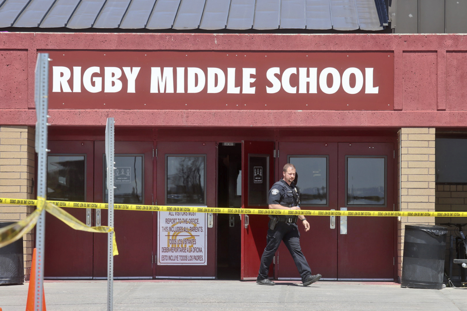 PHOTO: A police officer walks out of Rigby Middle School following a shooting there earlier Thursday, May 6, 2021, in Rigby, Idaho.