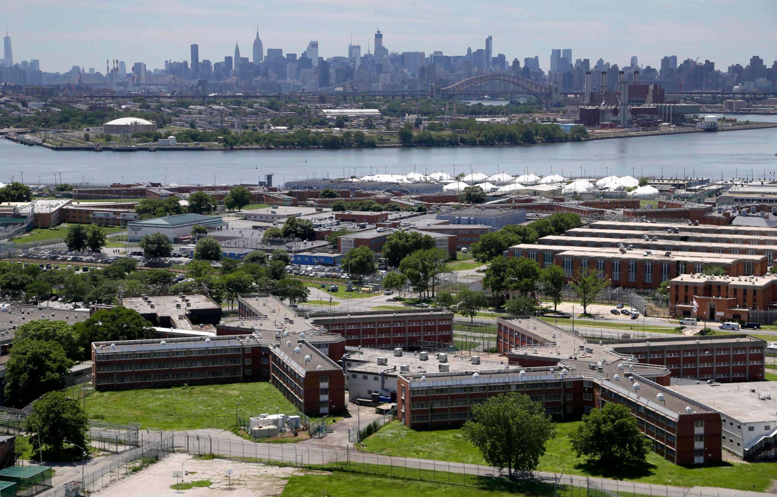 PHOTO: This June 20, 2014 file photo shows the Rikers Island jail complex in New York with the Manhattan skyline in the background.