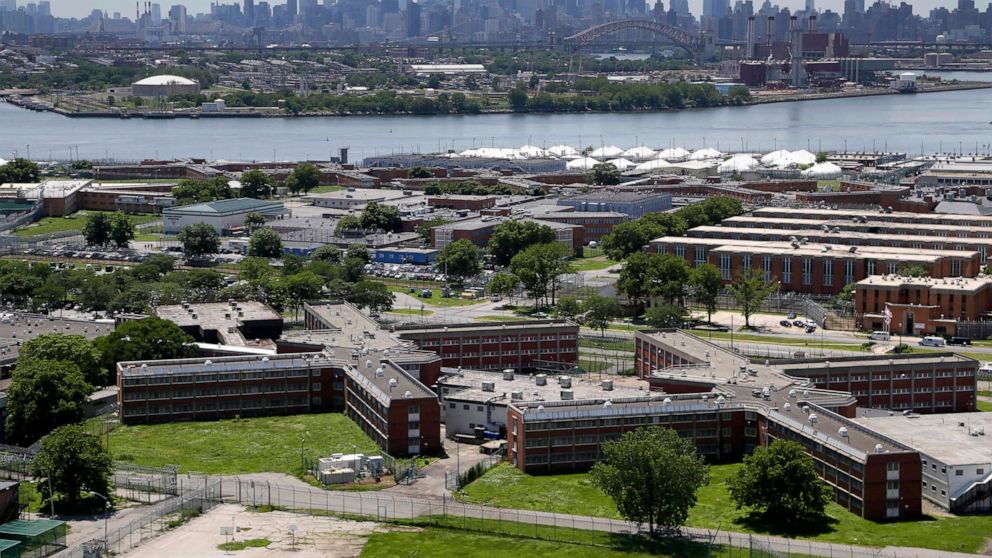 PHOTO: In this June 20, 2014, file photo, the Rikers Island jail complex stands in New York is shown with the Manhattan skyline in the background.