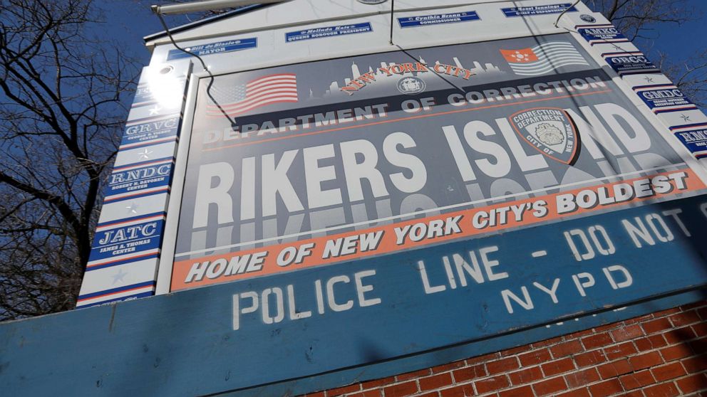PHOTO: Signage is seen outside of Rikers Island, a prison facility, where multiple cases of the coronavirus have been confirmed in Queens, New York, March 22, 2020. 