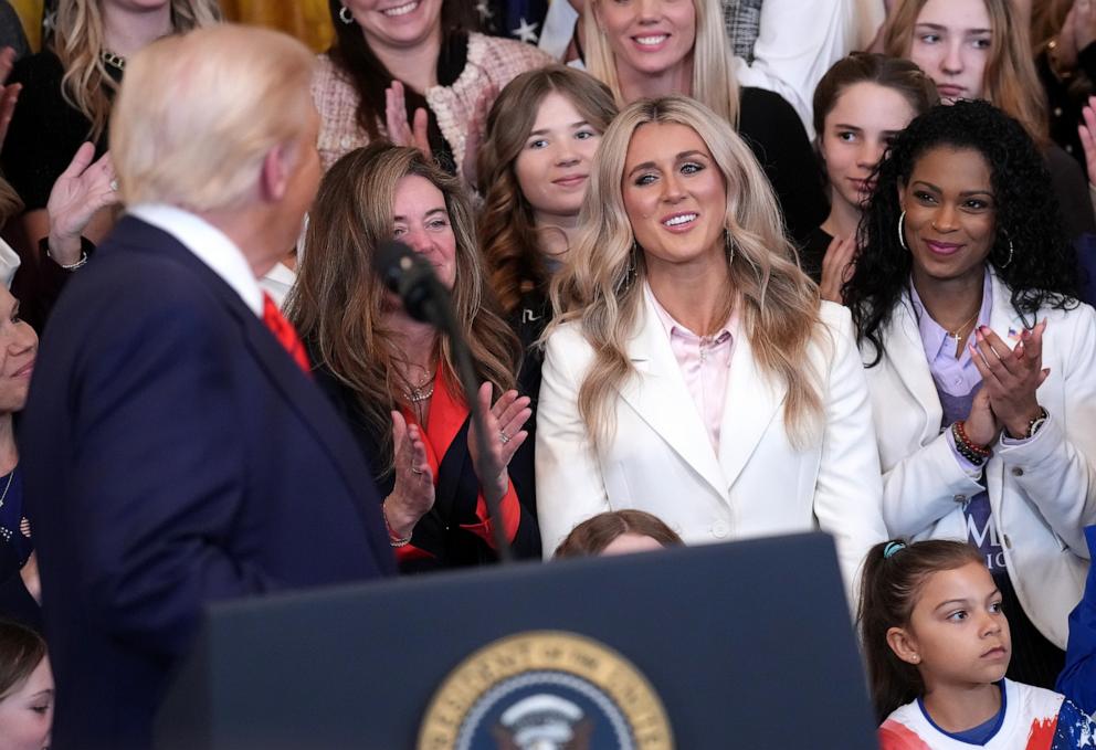 PHOTO: Political activist and former competitive swimmer Riley Gaines watches as President Donald Trump delivers remarks in the East Room at the White House, Feb. 5, 2025 in Washington.