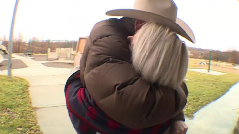 PHOTO: Amanda Lager hugs Bill Huffman on the day she returned his late brother's class ring to him.