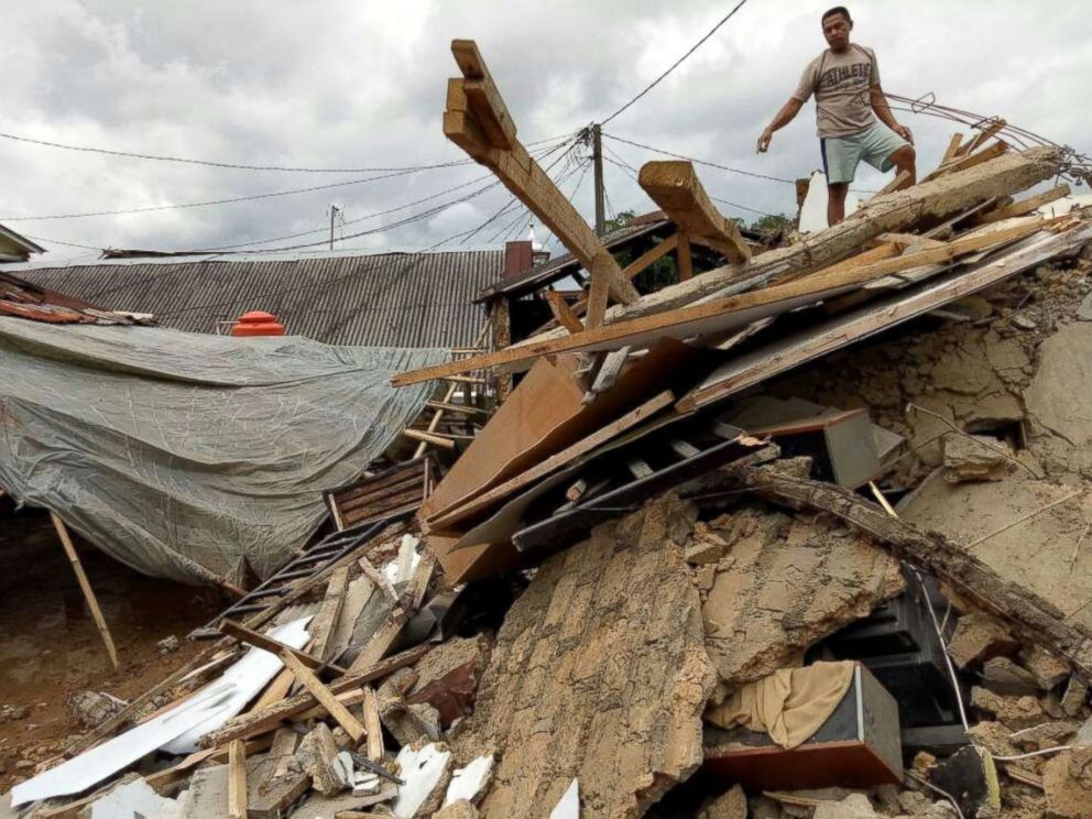 PHOTO: A resident stands on his damaged house after an earthquake at Megamendung village in Bogor, Indonesia, Jan. 23, 2018.