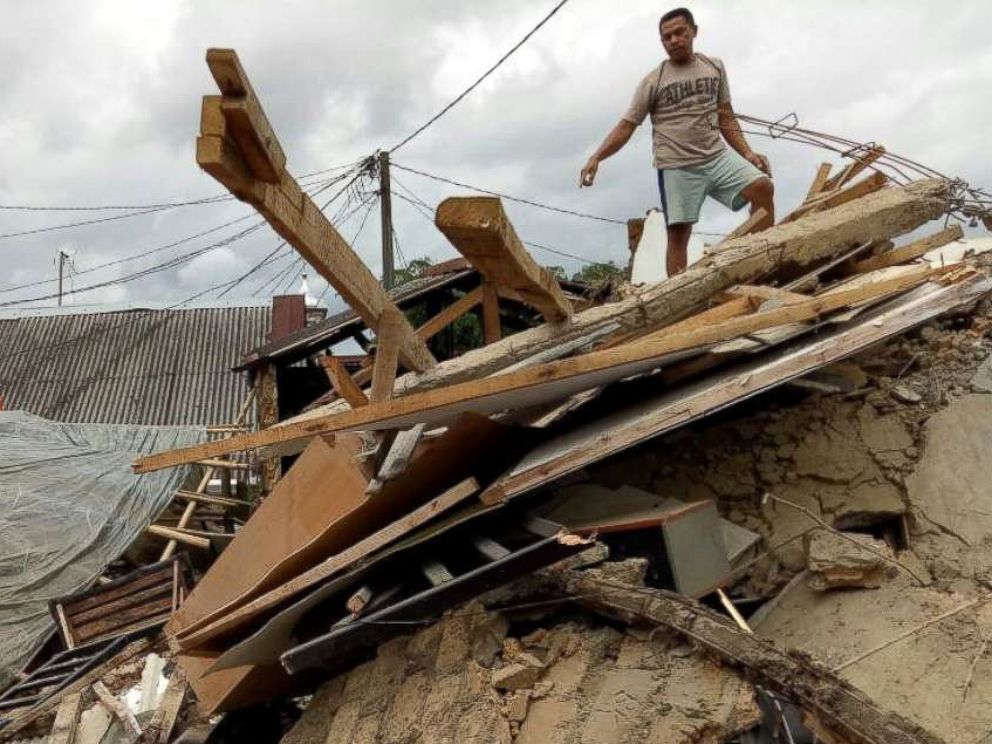 PHOTO: A resident stands on his damaged house after an earthquake at Megamendung village in Bogor, Indonesia, Jan. 23, 2018.